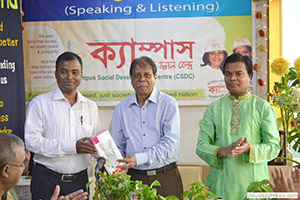 VC of the Bangladesh University of Textiles, Prof. Dr. Nitai Chandra Sutradhar is giving Special Gift to the Instructor of the Free English Course; Next to him Dr. M Helal. (2013)